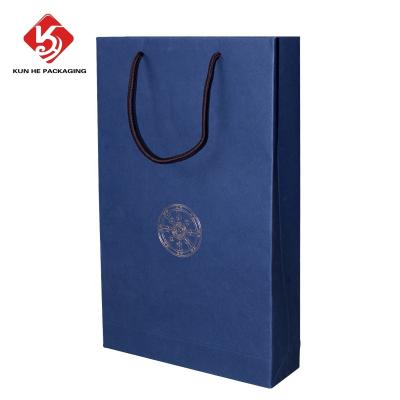 China Recyclable Custom Logo Printed Eco Friendly Kraft Paper Packaging Gift Shopping Bag For Clothing for sale