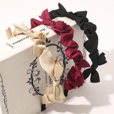 China Cute hot sale supplier wide knotted bow knot fabric hair band bow knot women headbands for sale