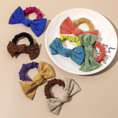 China Fashion Soft Suede Elastic Hair Scrunchies With Butterfly Bow For Girls Popular Colors Hair Double Tie for sale