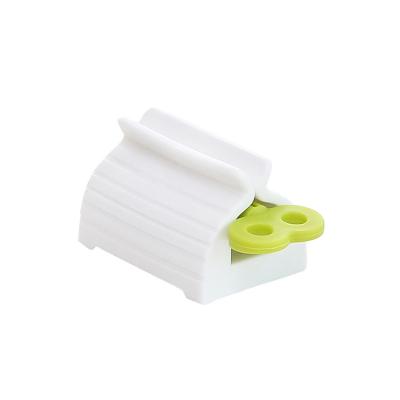 China Stocked Manual Toothpaste Extruder Bathroom Supplies Facial Toothpaste Detergent Extruder for sale