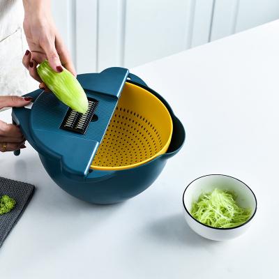 China Plastic Multifunctional Vegetable Grater Slicer Magic Rotate Vegetable Cutter With Drain Basket for sale