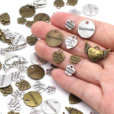 Chine Handbag Gold Handmade / Luggage / Custom Color Metal Silver Garment Labels Labels For Bags Hand Made Letter Printed Diy Sewing Labels à vendre