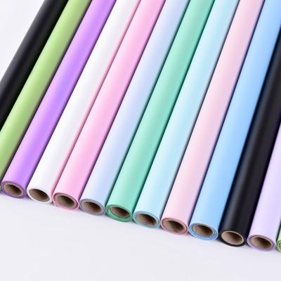 China ANTISTATIC Wholesale Design Flower Pure Color Shinewrap Paper Plastic Wrapping Paper Roll for sale