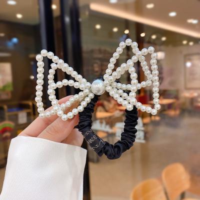 China Hair Accessories Internet Celebrity Main Light Luxury Side Clip Decoration Pearl Rosette Hairpin Women Simple Soft Wild Back for sale