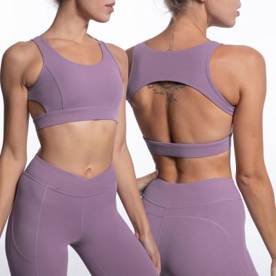 China New autumn feeling nude bodybuilding fitness yoga seamless wear low waist front cross backless bra backless sports pants suit for sale