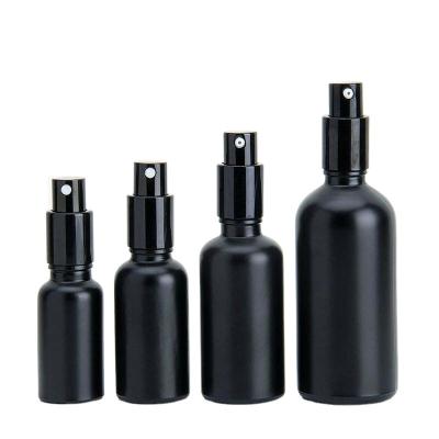 China Cosmetic Ready to Ship 20ml 30ml 50ml 100ml Matte Black Glass Cosmetic Bottle Empty Black Frosted Oil Foil Mist Pump Spray Bottle for sale