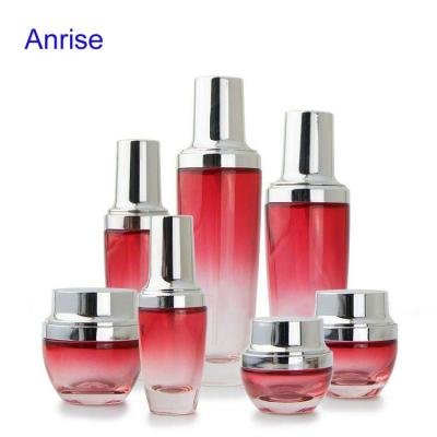 China New Designs Empty Personal Care Skin Care Cream Cosmetic Packaging Gradient Red Spray Glass Bottles And Glass Jars With Silver Cap for sale