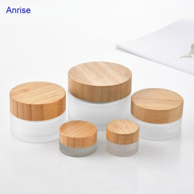 China 5ml 20ml 30ml 50ml 100ml cosmetic bamboo cosmetic container frosted clear glass cream jar with wooden bamboo lid for sale