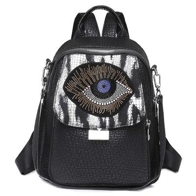 China 2022 Motion Detection Women's Backpack Bag Women's Dos Femme Rhinestone Evil Eye Bag for sale