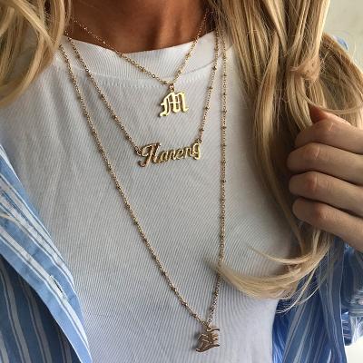 China Creative Environmentally Friendly Old Gold English Letter Necklace E M Pendant Multilayer Pendant Necklace (KNK5165) for sale