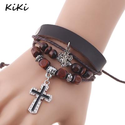 China Environmental Friendly Handmade Bracelet Leather Beads With Cross Dangle Bracelet Unisex Men's Leather Bracelets for sale