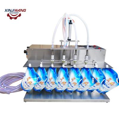 China Semi Automatic Products Stand Up Pouch Machine Liquid Pouch Filling Sealing Packing Machine for sale