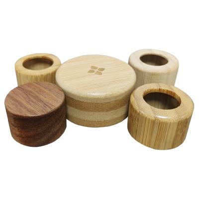 China Non-refillable cosmetic packaging with wooden bamboo cap dropper cap bamboo water bottle with bamboo cap for sale