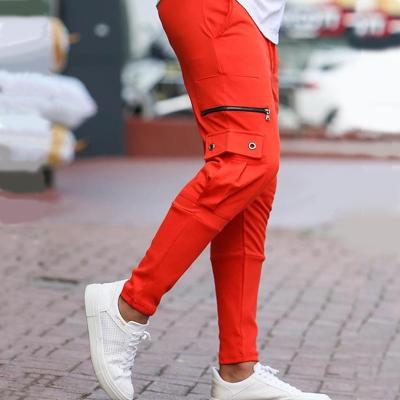 China Anti-Wrinkle Elasticity Leg Zipper Fitness Exercise Outdoor Walker Pants Men Side Pocket Training Pencil Pants for sale