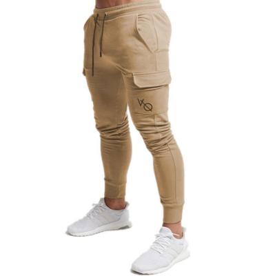 China Anti-wrinkle gym fitness elasticity sports good side pockets joggers sport jogger men pants for sale