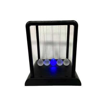 China 2021 Educational Europe Mystery Desk Toys Physics Science Pendulum Newton Cradle With LED Balls for sale