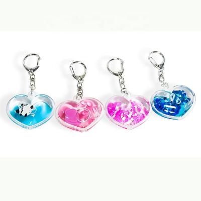 China Liquid Crystal Romantic Motion Shape Heart Shape Key Chain Key Chain With Mini Cute Animals for sale