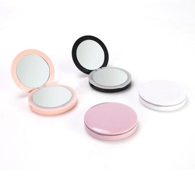 China Custom Portable Cosmetic Handheld Travel Lighted Small Round Pocket Logo Lighted Folding Makeup Mirror With Led Light for sale