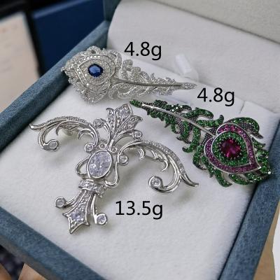 China 2022 925 Fashionable Wholesale High Quality Silver Peacock Feather Cross Brooches For Man Woman Gift for sale