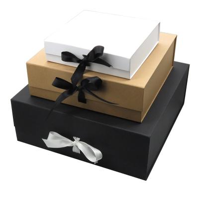 China Disposable White Black Blank Cardboard Magnet Kraft Paper Folding Lid Rigid Gift Box With Ribbon for sale