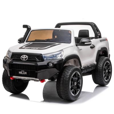 China Ride On Toy License TOYOTA HILUX Kids Electric Car 4 Motors SUV 2 Seaters Ride On Car for sale