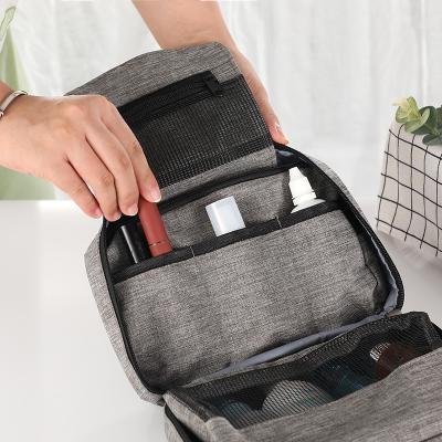 China Durable Portable Waterproof Oxford Hanging Hook Make Up Bag Organizer Folding Travel Toiletry Cosmetic Bag for sale