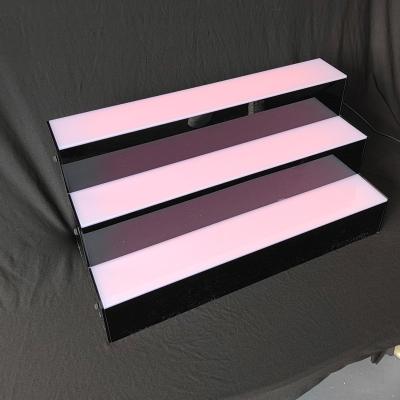 China Sustainable Warm Feeling Acrylic Made LED Lighting Wine Shelf for sale