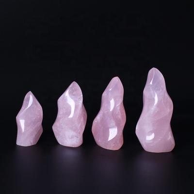 China Europe Wholesale Cut Rose Quartz Crystal Flame Healing Natural Crystal Gemstone Torch Stand Stone for Home Decoration for sale