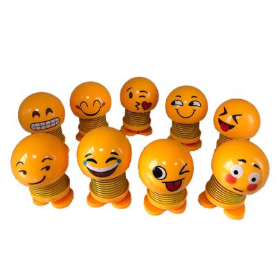 China Factory Price Automotive Cute Funny Spring Shaking Car Toys Rock Head Doll Heads for sale