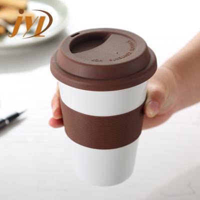 China Wholesale Viable Single Wall Travel Ceramic Coffee Mug Keep Hot Coffee Cup With Silicone Cover for sale