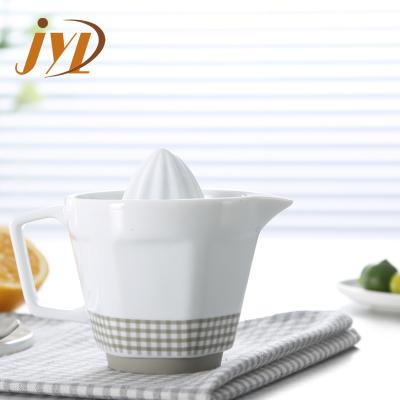 China Sustainable Hot Selling Ceramic Lemon Juice Squeezer With Silicone Base for sale