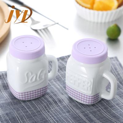 China Sustainable Most Popular Eco Friendly Kitchen Mini Ceramic Salt And Pepper Spice Shakers With Handles for sale