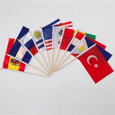 China Waterproof Digital Printing Polyester Country Hand Flag With Plastic Poles for sale