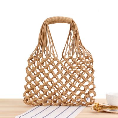 China New waterproof hand dug wovenbag tidal forest bag degree cotton rope net bag portable female grass woven beach bag for sale