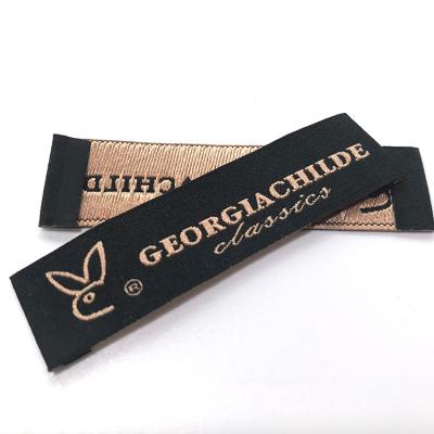 China Latest Customized Sustainable Garment Accessories Fabric Clothing Black Polyester Yarn Woven Labels For Garments for sale