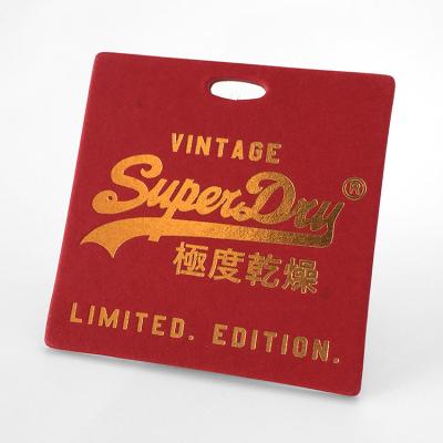 China Viable custom hot stamping gold foil thick red cardboard cheap clothing tags paper hang tag with logo for sale