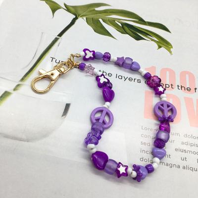 China Cute Multi Beads With Purple Colors In Gold Plated Accessory On Bag For Women And Girls for sale