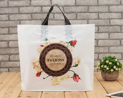 China Yiwu Wholesale Moisture Proof Color Draw Handle Plastic Die Cut Shopping Bag for sale