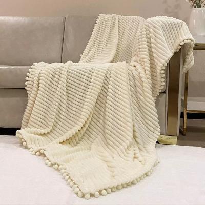 China 100% Polyester Microfiber Throw Ball Tassel Blanket Anti-Static Solid Flannel Cloth Luxury Woven Textile for sale