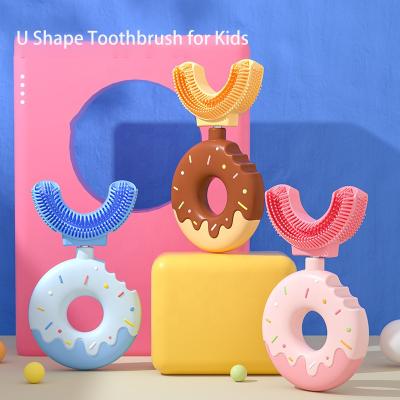 China Reusable Dinosaur Donut U Shape Whitening Massage Toothbrush Soft Silicone Brush Head 360 Oral Teeth Cleaning Design For Toddlers for sale