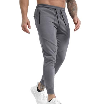 China Breathable Customized Training Gym Wear Slim Fit Joggers Men Sporty Running Jogging Sweatpants With Zipper Pockets for sale