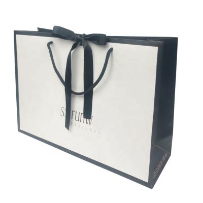 China Recyclable High Quality Luxury Boutique White Paper Gift Bag Shopping Bag With Ribbon Closure for sale