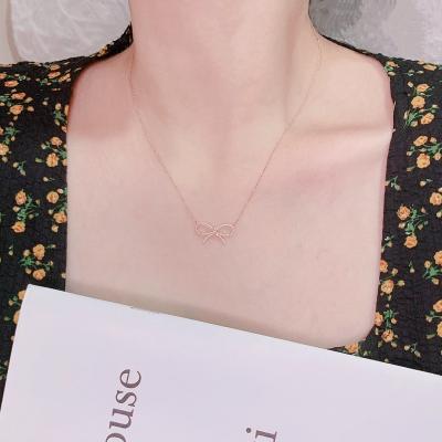 China Fashion High Quality New Simple Elegant Delicacy Personalized Gold Plated Cavity Knotted Bowknot Pendant Necklace for sale