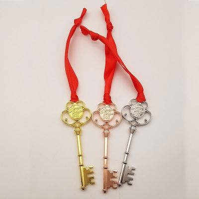 China Christmas Promotional Gifts Decoration Accessories Gold Silver Copper Shiny Santa's Magic Key With Ribbon for sale