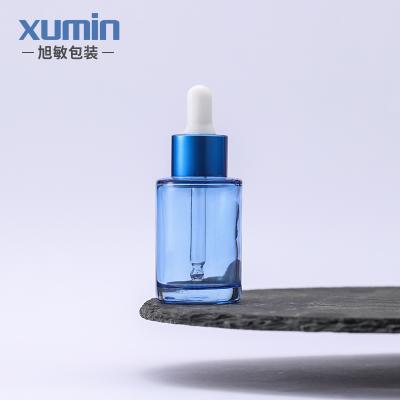 China Personal Care 30ml Light Blue Glass Dropper Bottle for sale