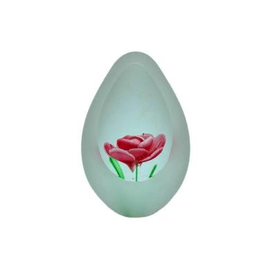 China International Egg Shaped Frosted Glass Paperweight Flower Inside Decoration Art Glass Glass for sale