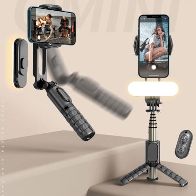 China Q09 Mini Fold Gimbal 360 Portable Stabilizer Foldable Flexible Selfie Stick Smart Tripod With Fill Selfie Led Light for sale