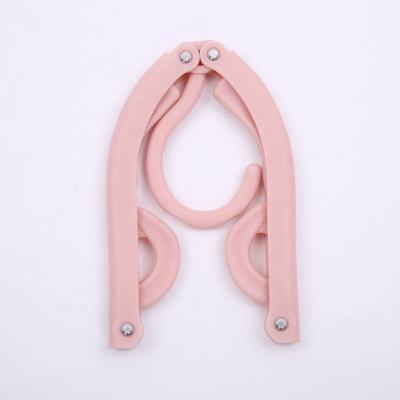 China New Classic/Postmodern Plastic Cloth Wall Hanger Folding Clothes Retractable Hangers For Clothes Space Saving Hangers Organizer For Home Use for sale