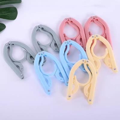 China New Portable Folding Hangers Classic/Postmodern Travel Hangers Travel Accessories Foldable Clothes Drying Rack For Travel for sale