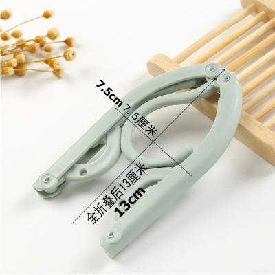 China New classic/postmodern folding portable plastic hangers for sale